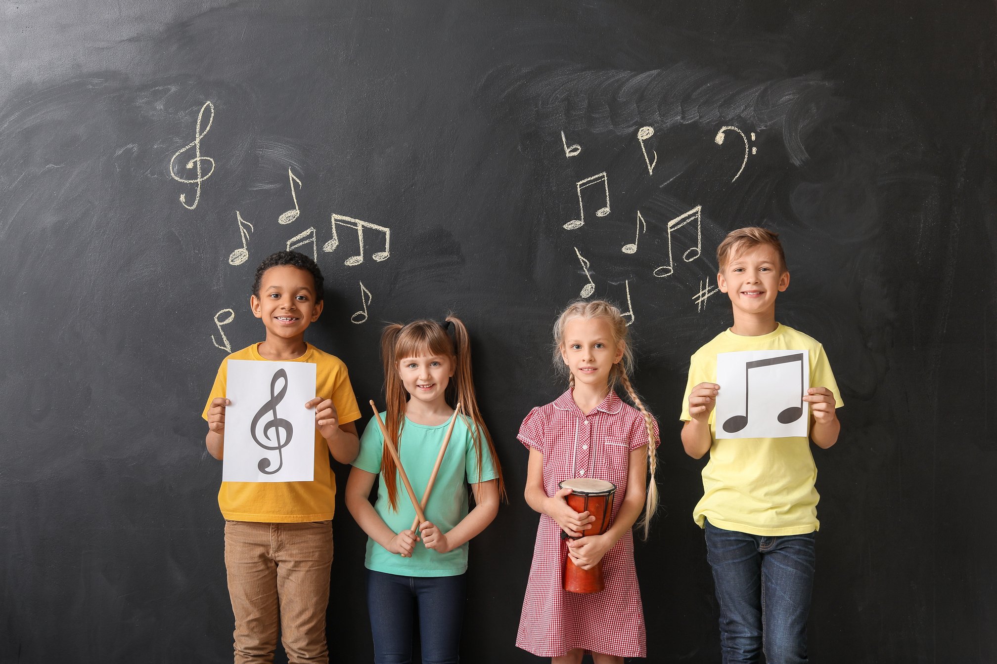 Little Children near Chalkboard at Music School